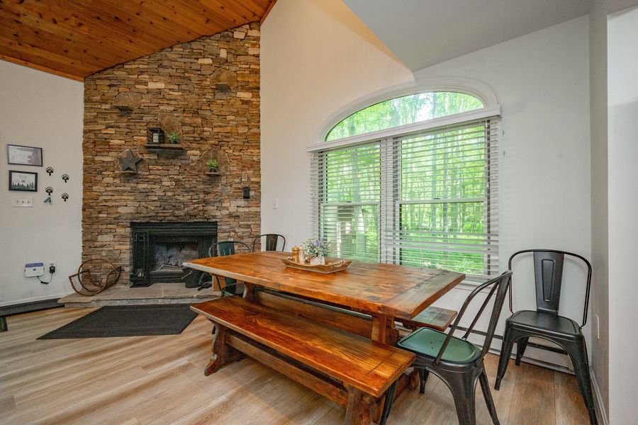 Dining area with stone fireplace
