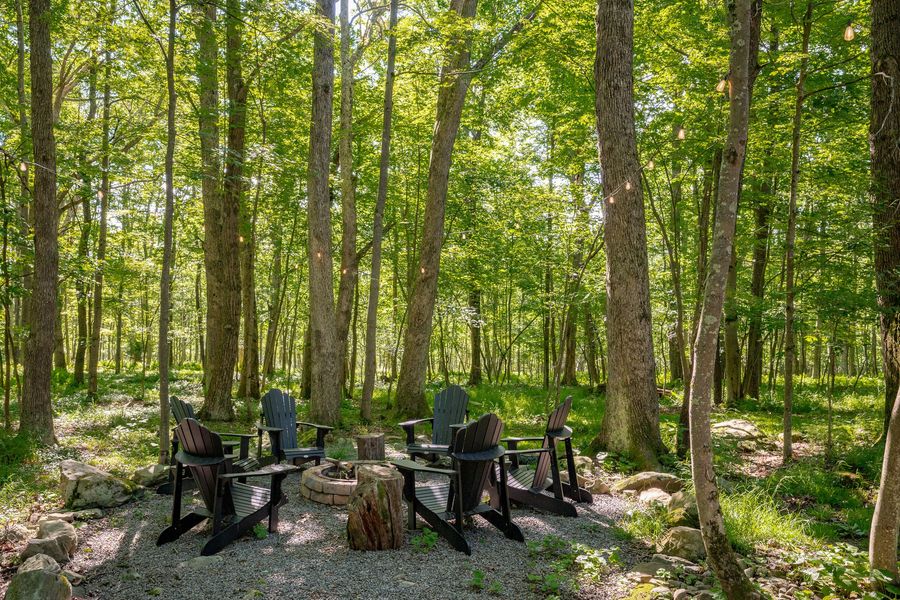 Outdoor fire pit with Adirondack chairs